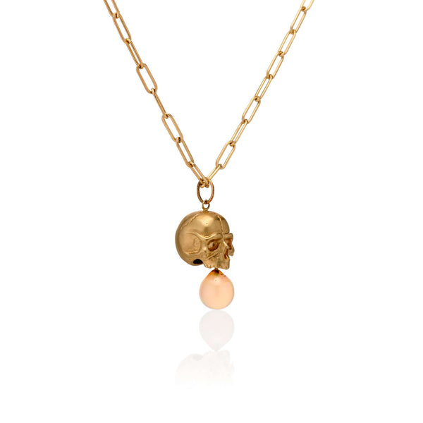 Necklaces 14k Gold & Opal Nehama Pendant A satin finished pendant inspired by a skull found in the Paris Catacombs. This hollow 14k gold skull features a gorgeous hand carved natural opal drop. This statement making pendant is named after Sarah Nehama, a
