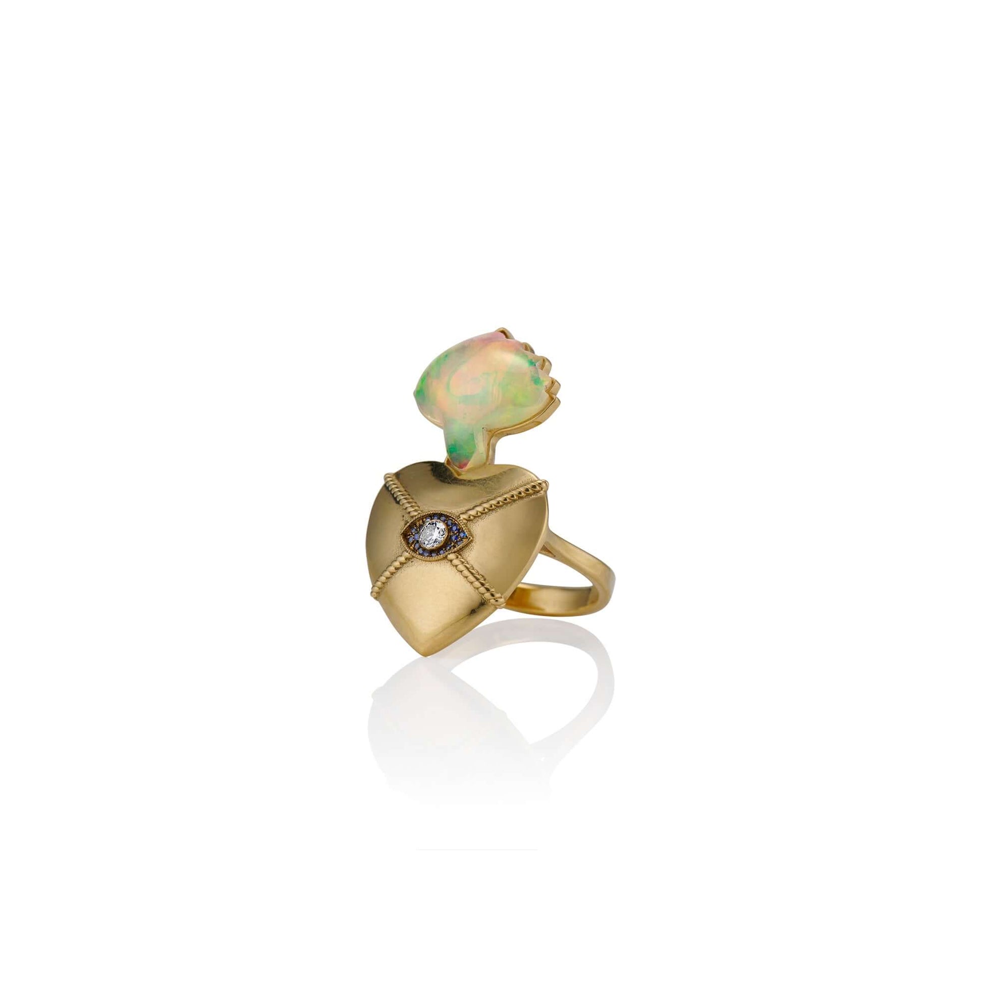 18k Gold Sacred Love Ring18k Gold Ring inspired by sacred heart imagery with a Hand carved Opals the flame and a diamond set in the eye of the heart for protection.18k Gold Sacred Love Ring18k Gold Ring inspired by sacred heart imagery with a Hand carved