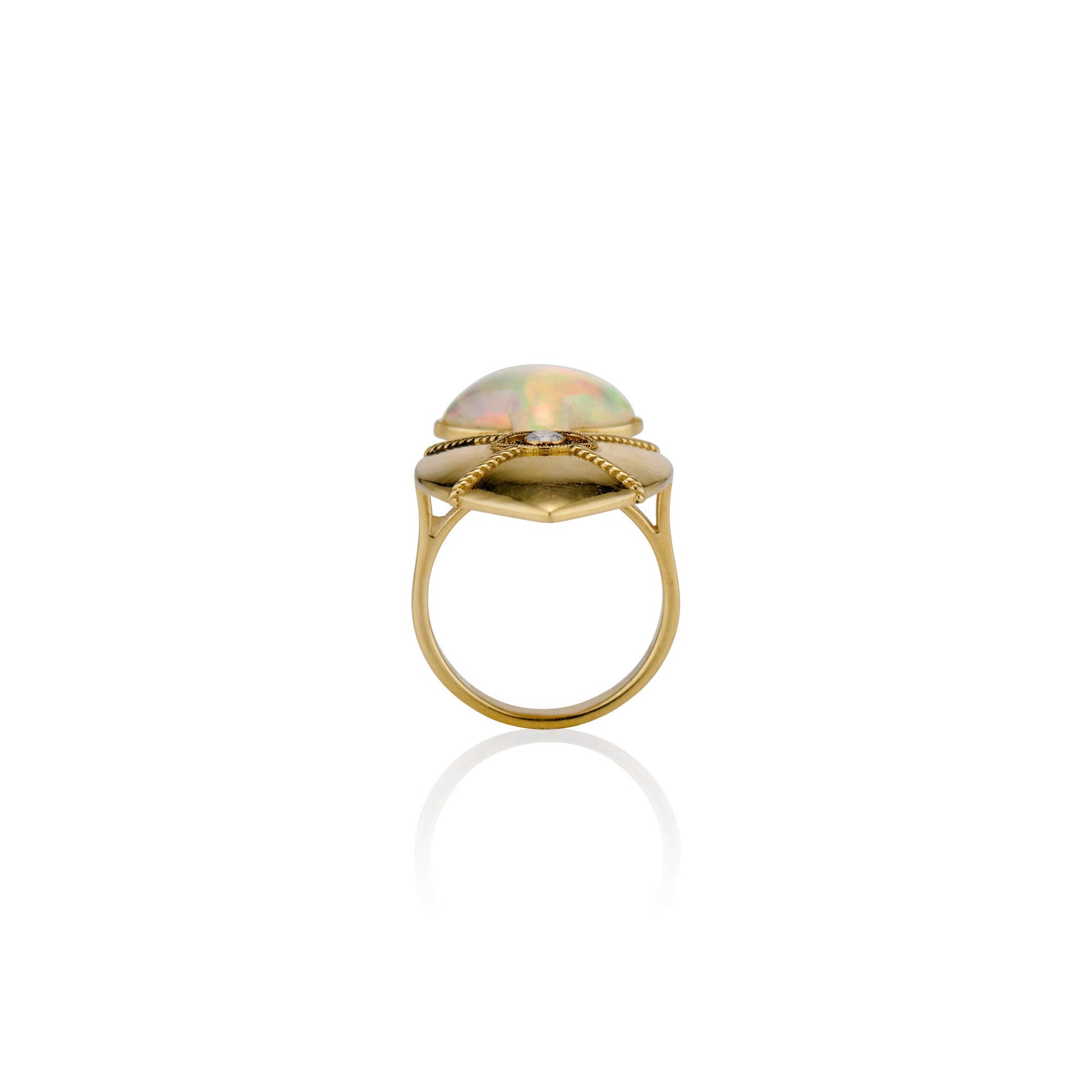 18k Gold Sacred Love Ring18k Gold Ring inspired by sacred heart imagery with a Hand carved Opals the flame and a diamond set in the eye of the heart for protection.18k Gold Sacred Love Ring18k Gold Ring inspired by sacred heart imagery with a Hand carved