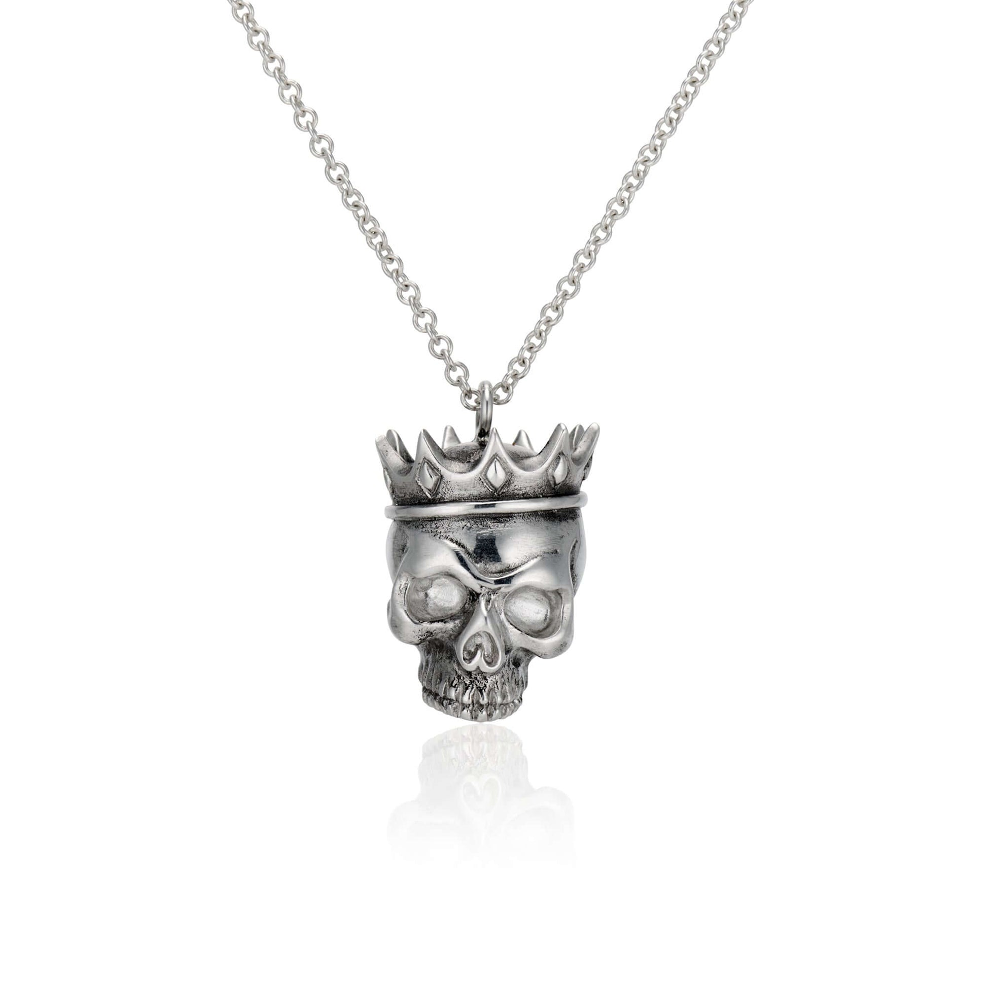 Crowned Skull Pendant: Wear Art & Give BackUnique hand-designed Crowned Skull Pendant with 18” chain. Inspired artistry meets charity with 10% sales to aid disaster relief. Crafted in NYC.CROWNED SKULL PENDANTInspired by the eye of a hurricane and the god