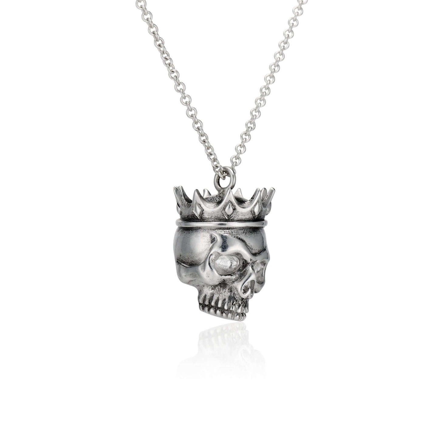 Crowned Skull Pendant: Wear Art & Give BackUnique hand-designed Crowned Skull Pendant with 18” chain. Inspired artistry meets charity with 10% sales to aid disaster relief. Crafted in NYC.CROWNED SKULL PENDANTInspired by the eye of a hurricane and the god