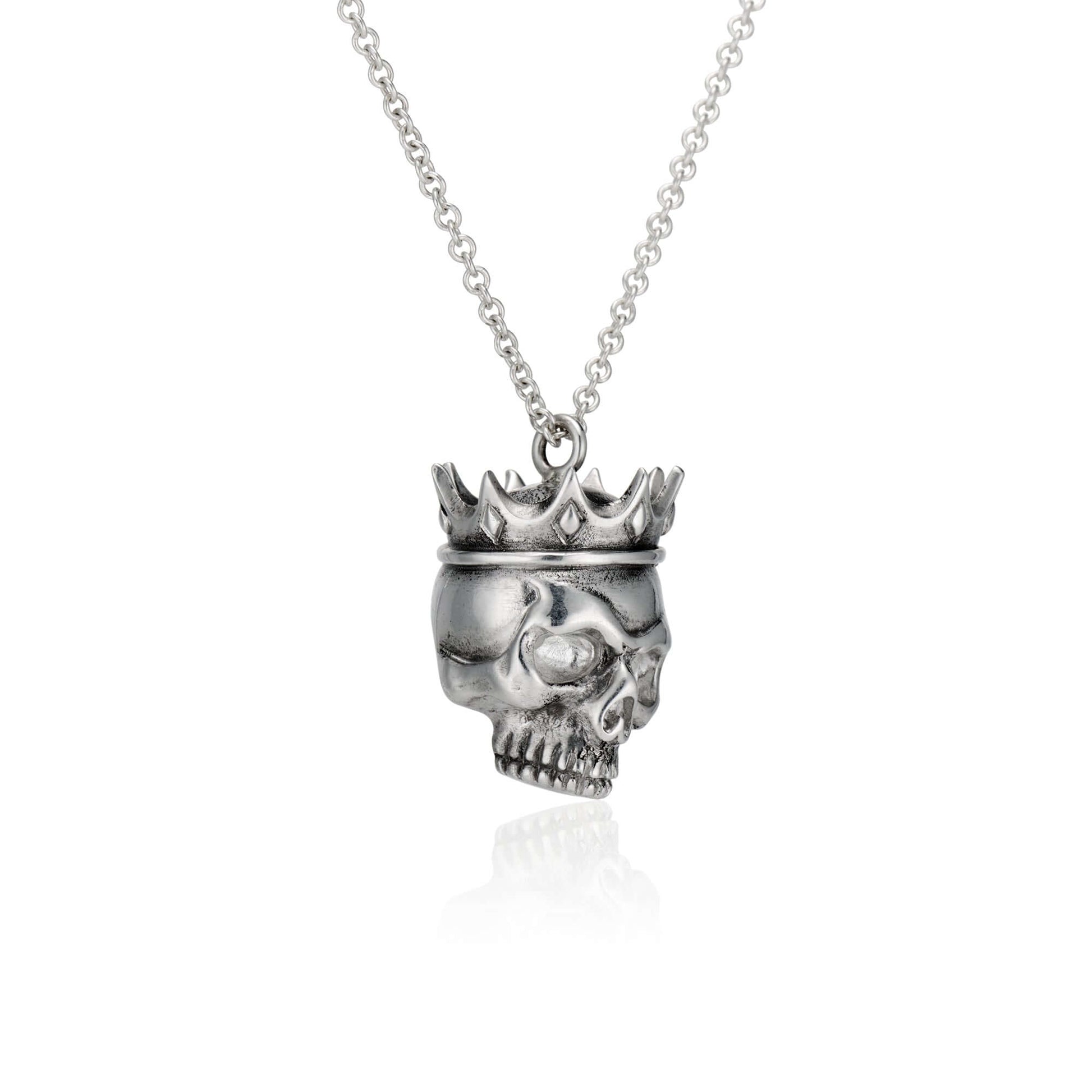 Crowned Skull Pendant: Wear Art & Give BackUnique hand-designed Crowned Skull Pendant with 18” chain. Inspired artistry meets charity with 10% sales to aid disaster relief. Crafted in NYC.CROWNED SKULL PENDANTInspired by the eye of a hurricane and the god