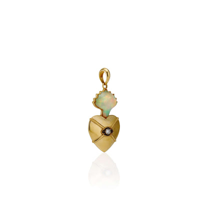 18k Gold Sacred Love Pendant18k Gold Pendant inspired by sacred heart imagery with a Hand carved Opals the flame and a diamond set in the eye of the heart for protection.18k Gold Sacred Love Pendant18k Gold Pendant inspired by sacred heart imagery with a