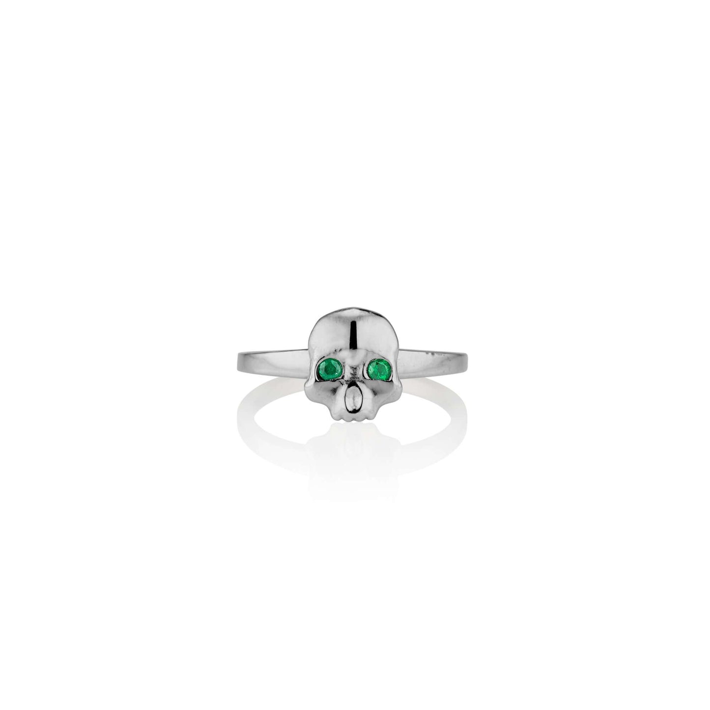 Platinum and Emerald Ossification RingA little skull ring for every day wear. We wanted to design a fun and simple skull ring that adds the perfect amount of goth and that could stack well with other rings. We're so excited to now offer this piece in shin