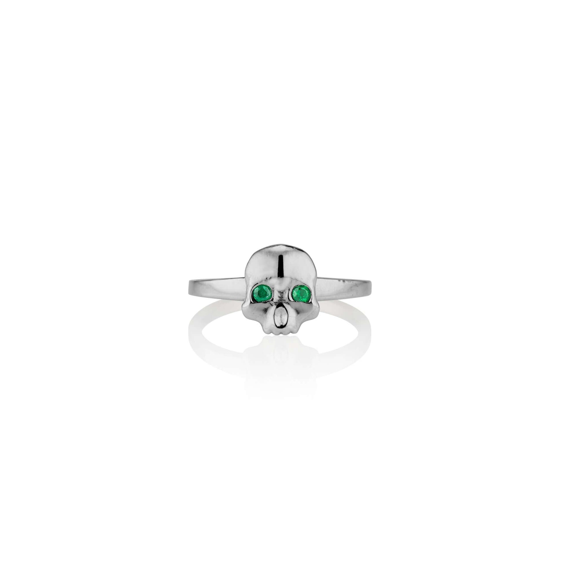 Platinum and Emerald Ossification RingA little skull ring for every day wear. We wanted to design a fun and simple skull ring that adds the perfect amount of goth and that could stack well with other rings. We're so excited to now offer this piece in shin