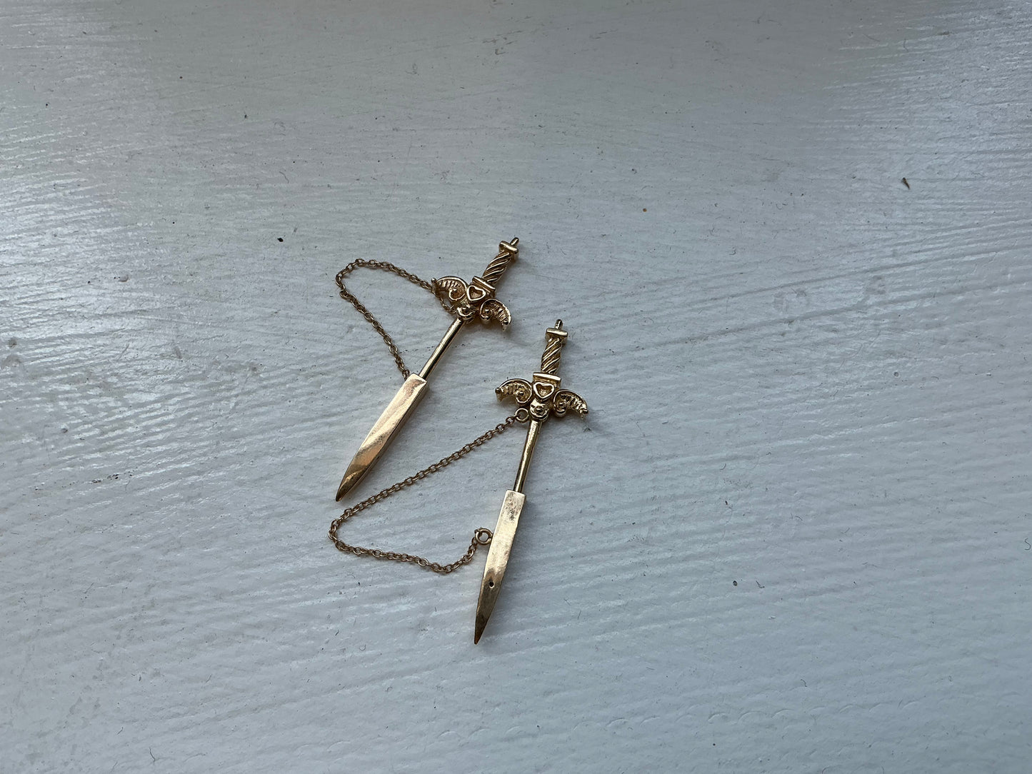 Agape Sword EarringsA fresh take on the sword earring and an evolution from our earlier sword earrings from 2019. These statement making earrings are inspired by antique jabots, sword or arrow pins that would be worn on a jacket or scarf. Created entirely