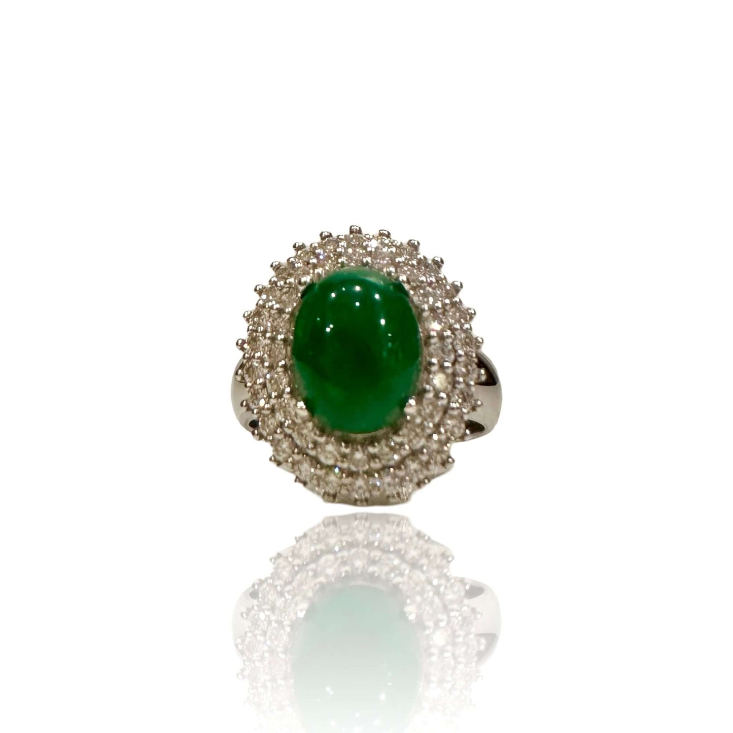 Vintage Diamond and Jade Ring in 14k White GoldGorgeous Jade Cabochon set in a halo of white diamonds. TCW of the diamonds is 0.75cts. Ring is 14k White Gold Condition: Normal antique wear Metal: 14k White Gold Dimensions: Size 6Vintage Diamond and Jade R