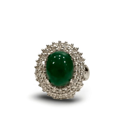 Vintage Diamond and Jade Ring in 14k White GoldGorgeous Jade Cabochon set in a halo of white diamonds. TCW of the diamonds is 0.75cts. Ring is 14k White Gold Condition: Normal antique wear Metal: 14k White Gold Dimensions: Size 6Vintage Diamond and Jade R