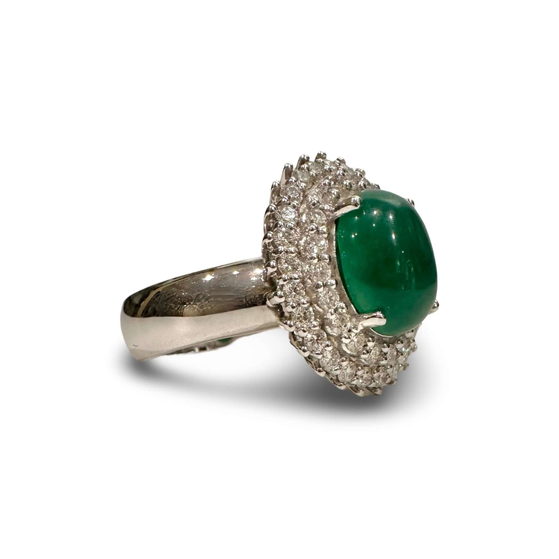 Vintage Diamond and Jade Ring in 14k White GoldGorgeous Jade Cabochon set in a halo of white diamonds. TCW of the diamonds is 0.75cts. Ring is 14k White Gold Condition: Normal antique wear Metal: 14k White Gold Dimensions: Size 6Vintage Diamond and Jade R