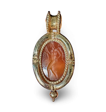 Carnelian Intaglio set into 18k gold, Standing WarriorCarnelian Intaglio set into 18k gold, Standing Warrior, 18k, Condition: Normal antique wear Dimensions: 1.25", 10.1g Carnelian Intaglio set into 18k gold, Standing Warrior Carnelian Intaglio set into 1