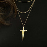 18k Gold Kelly Sword PendantA Luxe sword 18k Gold Kelly Sword Pendant for the individual wanting to make a powerful statement. Our Jewelry is proudly idealized, and produced in NYC.18k Gold Kelly Sword PendantA Luxe sword pendant for the individual wantin