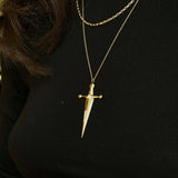 18k Gold Kelly Sword PendantA Luxe sword 18k Gold Kelly Sword Pendant for the individual wanting to make a powerful statement. Our Jewelry is proudly idealized, and produced in NYC.18k Gold Kelly Sword PendantA Luxe sword pendant for the individual wantin