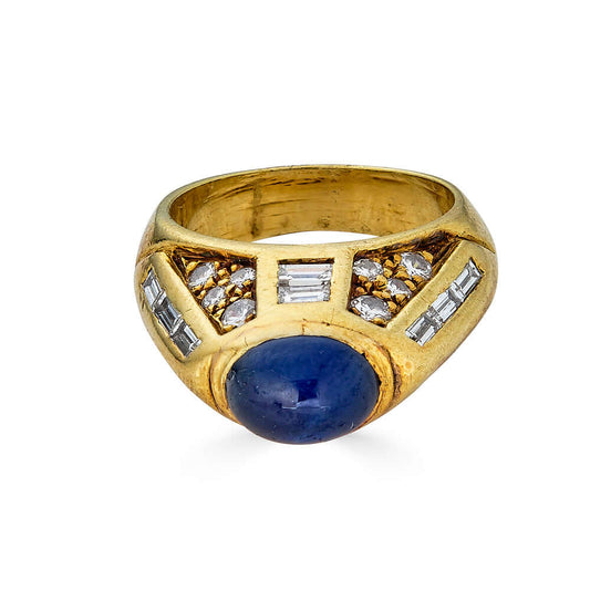 Vintage Sapphire and Diamond Dome Ring, 18kIncredible one of a kind vintage find! This dark and opaque sapphire cabochon sits atop a tower of round and baguette pave diamonds. Being a US size 4 this ring would make quite the statement on a pinky - especia