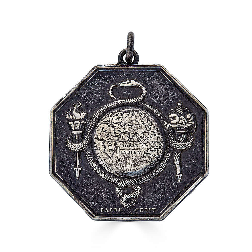 Late Georgian/Early Victorian French Ouroboros MedallionThis unique medallion features the classic Ouroboros symbol, representing eternity and renewal, elegantly encircling a map of the earth, focused on the Indian Ocean. The inscription on the opposite s