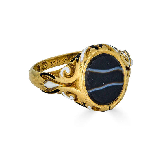 Early Victorian Striped Agate Signet RingIntroducing a distinguished piece dating back to 1844. This size 8.5 ring, weighing 8.06 grams, features a striking striped agate stone, exuding timeless elegance and sophistication. Crafted with meticulous detail,