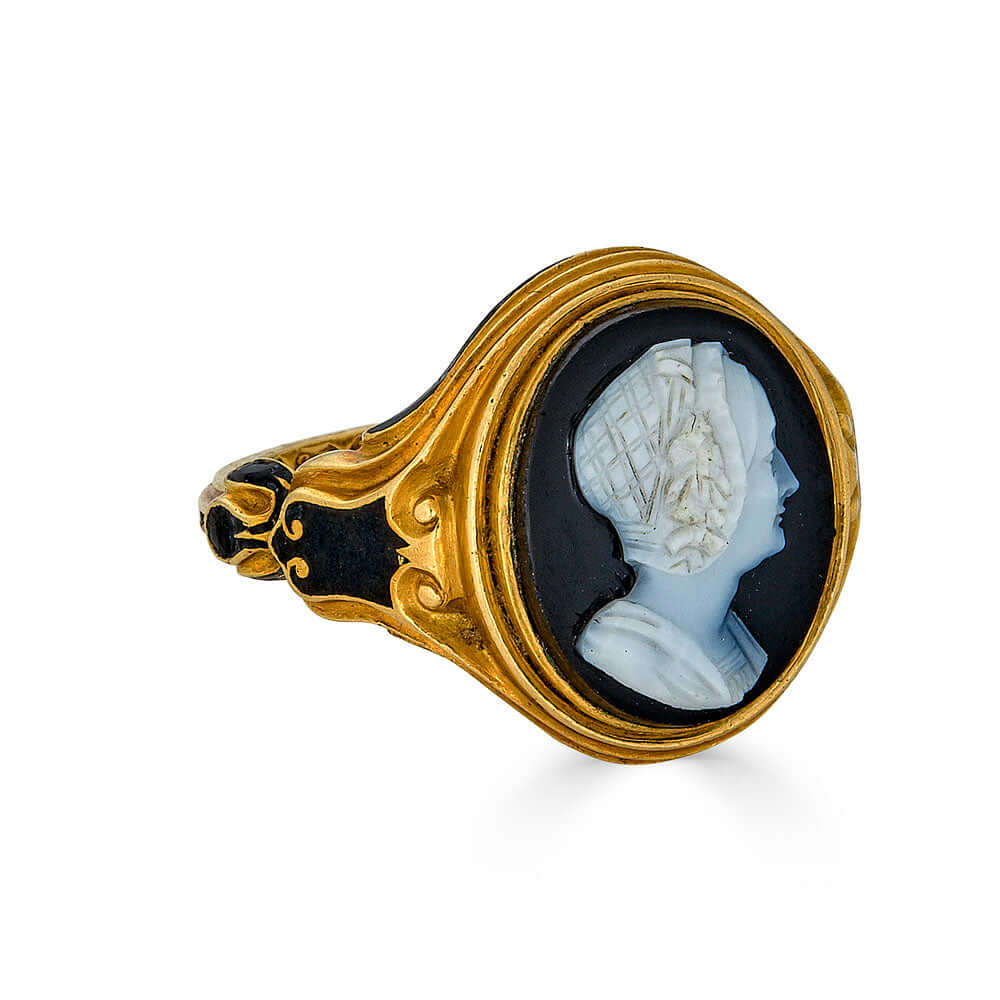 Early Victorian Cameo Portrait Mourning RingIntroducing the Early Victorian Cameo Portrait Mourning Ring, a captivating piece from 1854 that exudes timeless elegance and historical significance. This size 7 ring, weighing 9.4 grams, is meticulously crafte