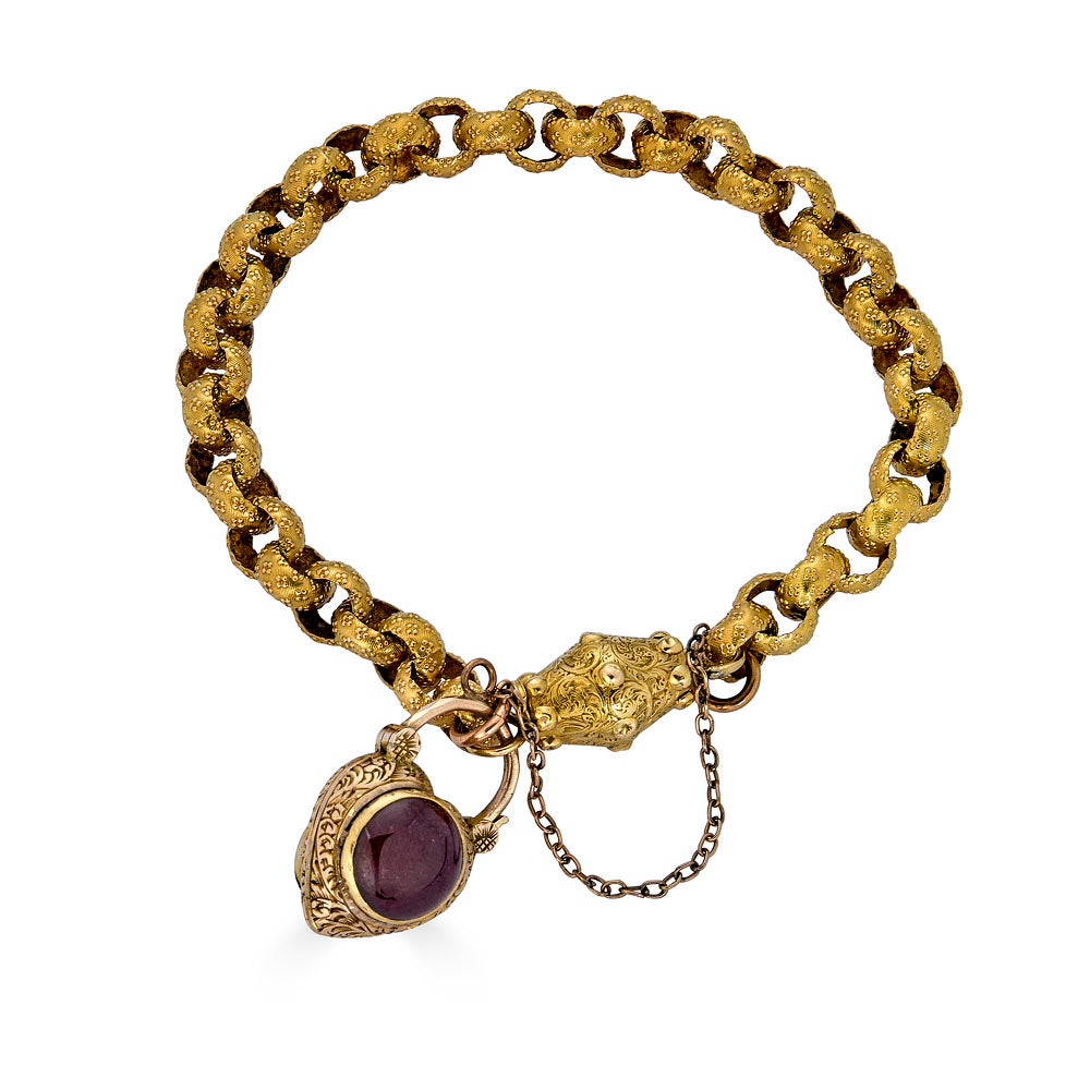 Georgian Era Gold Link Bracelet with Foiled Garnet PadlockMeasuring 7 inches in length, this elegant bracelet features a stunning foiled garnet padlock, showcasing the exceptional craftsmanship of the Georgian period. Likely of English origin, this bracel