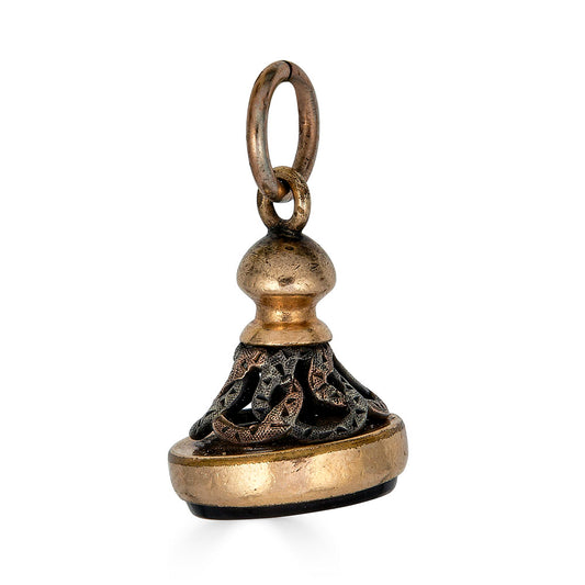 Victorian Onyx Signet FobCrafted from luxurious rose gold and silver, this fob features a stunning onyx stone expertly carved with the image of Hermes, the Greek god of travel and trade. The intricate Victorian-era detailing showcases the exceptional craf