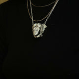 Medusa PendantThe story of Medusa has been interpreted and told differently throughout the ages. One story tells of Medusa punished with serpent hair by the goddess Athena. Another describes Medusa as one of three gorgons birthed by sea gods Keto and Phor