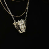 Medusa PendantThe story of Medusa has been interpreted and told differently throughout the ages. One story tells of Medusa punished with serpent hair by the goddess Athena. Another describes Medusa as one of three gorgons birthed by sea gods Keto and Phor