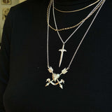 Agape Sword PendantA more romantic and whimsical take on our Kelly Sword pendant. Inspired by the more organic motifs from our Teras Collection, we decided to create a second sword pendant for our collection that was a bit more detailed while still being