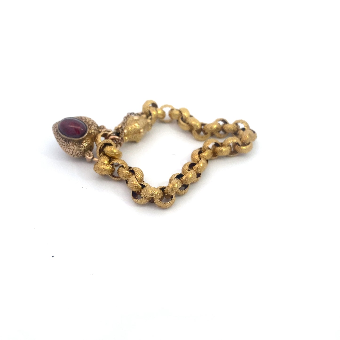 Georgian Era Gold Link Bracelet with Foiled Garnet PadlockMeasuring 7 inches in length, this elegant bracelet features a stunning foiled garnet padlock, showcasing the exceptional craftsmanship of the Georgian period. Likely of English origin, this bracel