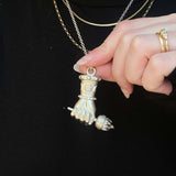 Hekate Aristera - The TorchBased on the traditional Figa the Mano Fica, this pendant is intended to be a symbol to ward of evil and protect the wearer. The inspiration behind it was Hekate, the greek god of witchcraft, the moon, and femininity. In her han