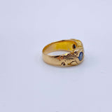 Hand Chased Victorian Ring with SapphiresA lovely c. 1890s Victorian ring hand chased with what appears to be a snake motif. 3 large sapphires are set into the ring. This ring has an amazing weight to it. Condition: Normal antique wear, very minimal scrat