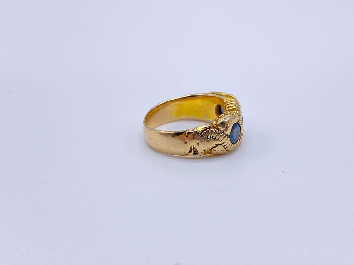 Hand Chased Victorian Ring with SapphiresA lovely c. 1890s Victorian ring hand chased with what appears to be a snake motif. 3 large sapphires are set into the ring. This ring has an amazing weight to it. Condition: Normal antique wear, very minimal scrat