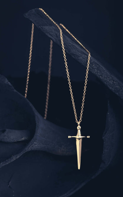 Mini Sword PendantA tiny dagger as a symbol of protection and strength. Sword jewelry is very wearable and this tiny sword was birthed for those who want something a bit more delicate to wear compared to their larger counterparts. Each sword comes on a 18