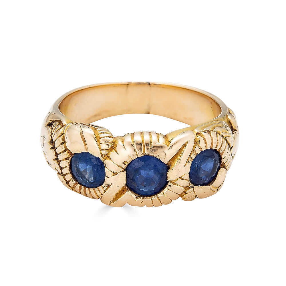 Hand Chased Victorian Ring with SapphiresA lovely c. 1890s Victorian ring hand chased with what appears to be a snake motif. 3 large sapphires are set into the ring. This ring has an amazing weight to it. Condition: Normal antique wear, very minimal scrat