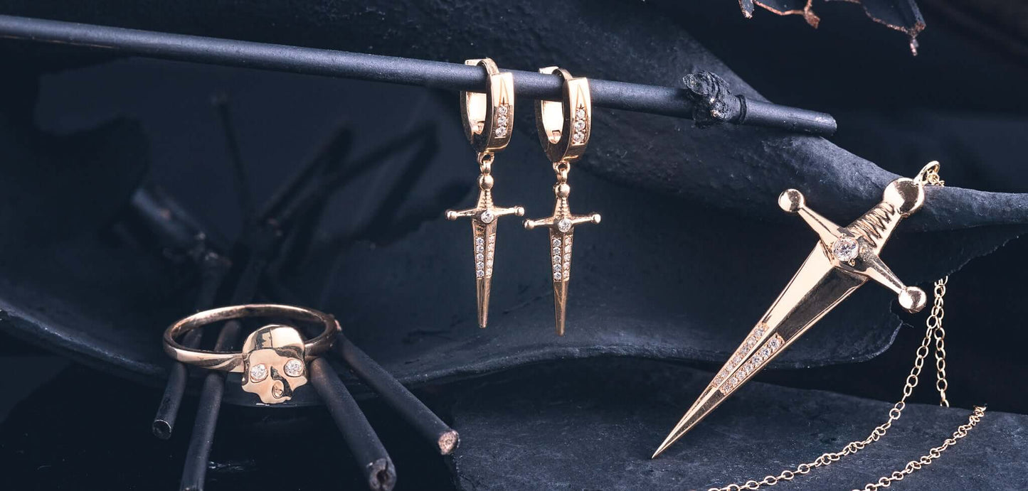 18k Gold Kelly Sword EarringsA Pair of solid gold 18k Gold Kelly Sword Earrings that make a statement. Swords are iconic symbols of strength and these unisex earrings embody this. 18k Gold Kelly Sword EarringsA Pair of solid gold earrings that make a stat