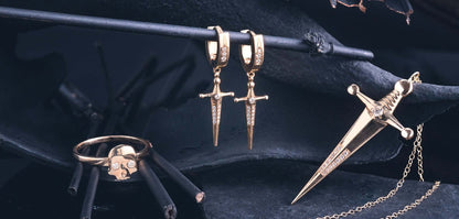 18k Gold Kelly Sword EarringsA Pair of solid gold 18k Gold Kelly Sword Earrings that make a statement. Swords are iconic symbols of strength and these unisex earrings embody this. 18k Gold Kelly Sword EarringsA Pair of solid gold earrings that make a stat