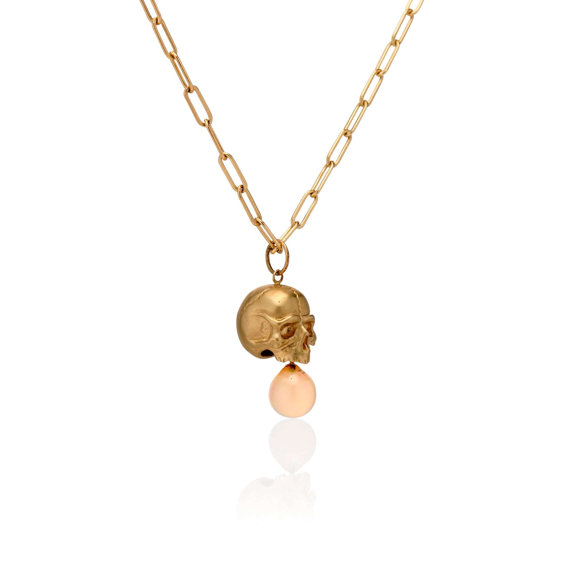 Necklaces 14k Gold & Opal Nehama Pendant A satin finished pendant inspired by a skull found in the Paris Catacombs. This hollow 14k gold skull features a gorgeous hand carved natural opal drop. This statement making pendant is named after Sarah Nehama, a