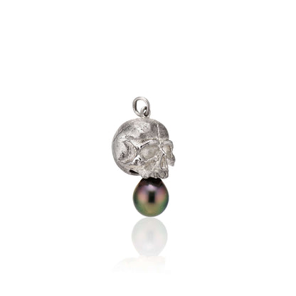 Nehama PendantA satin finished pendant inspired by a skull found in the Paris Catacombs. This hollow sterling silver skull features a hand picked black Tahitian pearl or golden south sea pearl. This statement making pendant is named after Sarah Nehama, a