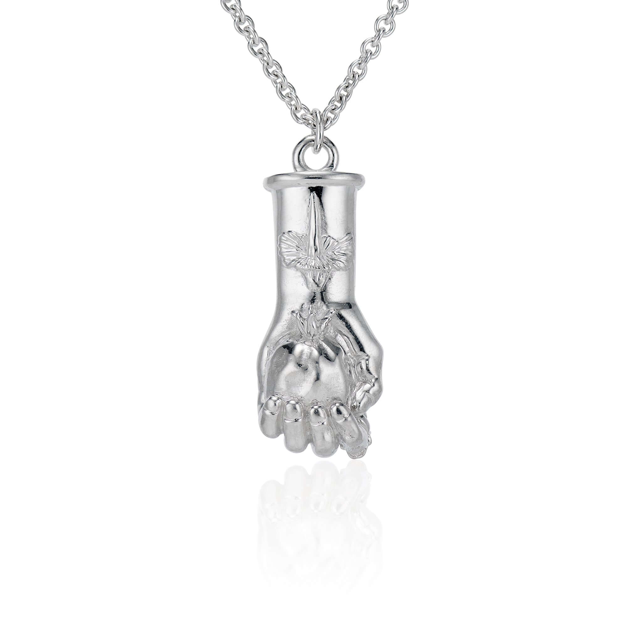 The Piásimo Pendant - Hades' GraspBased on the traditional Figa the Mano Fico, this pendant is intended to be a symbol to ward of evil and protect the wearer. The inspiration behind it was Hekate, the greek god of witchcraft, the moon, and femininity. In