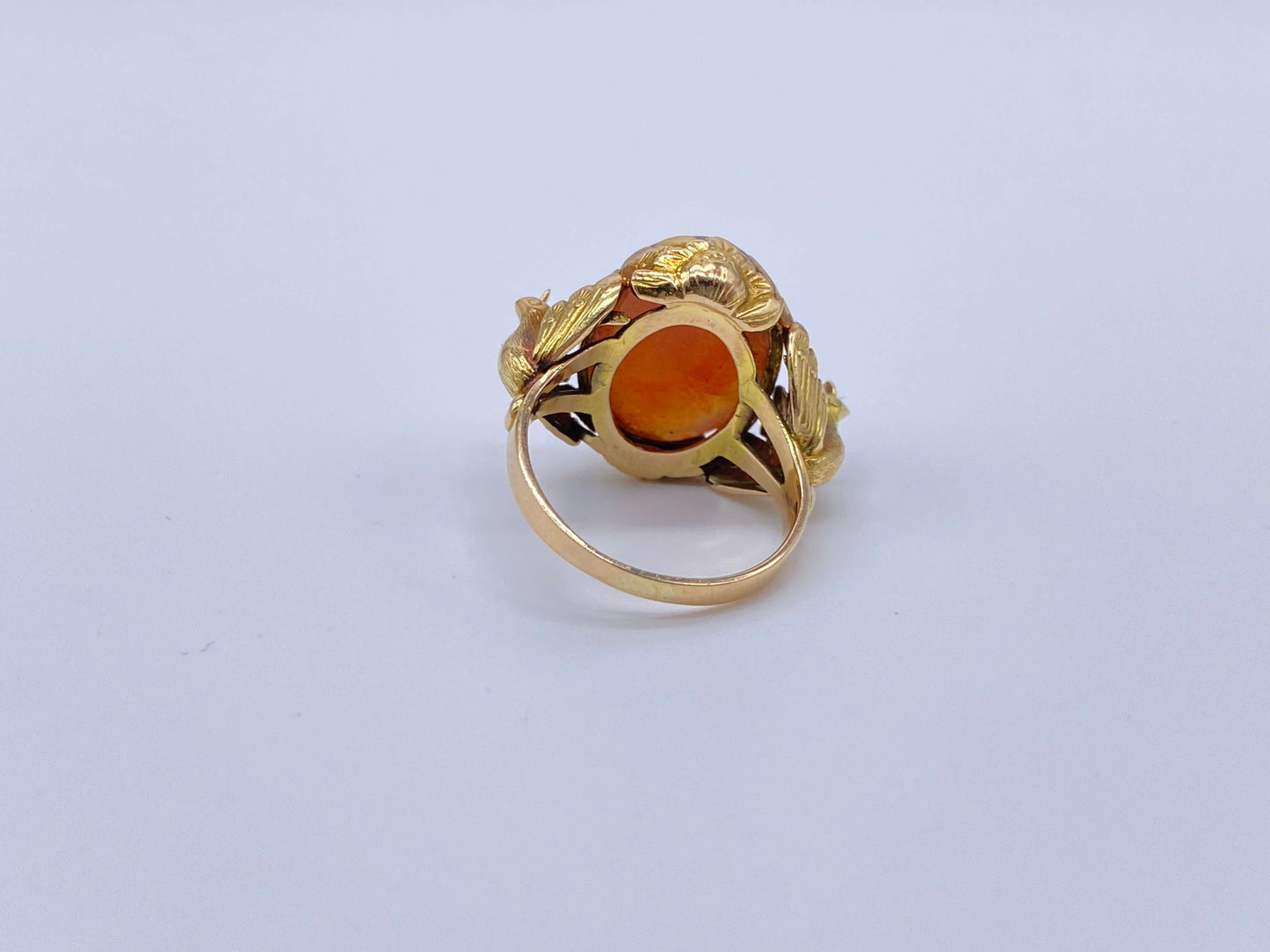 Antique Victorian Carnelian Peacock RingA gorgeous late Victorian ring with a substantial central carnelian stone. This ring has beautiful ruffled gold work around the stone. Two peacocks are suspended right above the shank. Condition: Normal antique wear