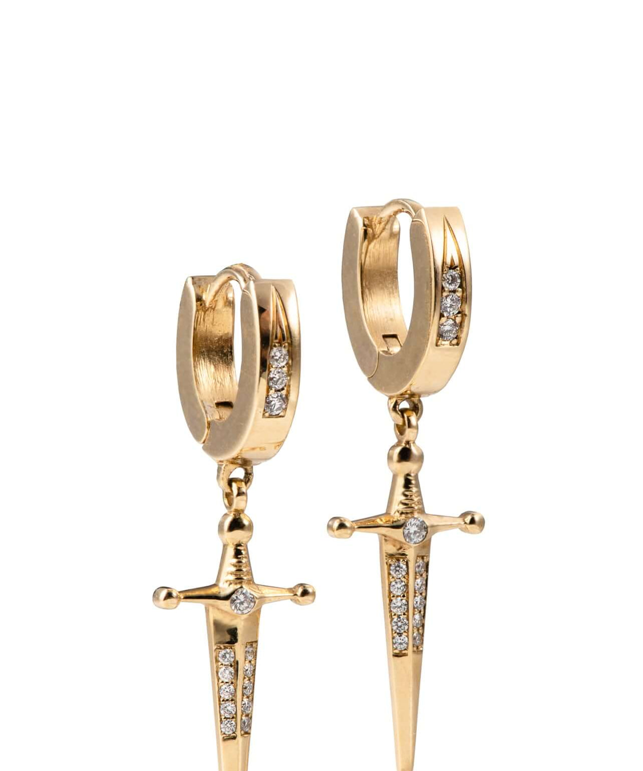 18k Gold Kelly Sword EarringsA Pair of solid gold 18k Gold Kelly Sword Earrings that make a statement. Swords are iconic symbols of strength and these unisex earrings embody this. 18k Gold Kelly Sword EarringsA Pair of solid gold earrings that make a stat