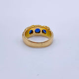 Hand Chased Victorian Ring with SapphiresA lovely c. 1890s Victorian ring hand chased with what appears to be a snake motif. 3 large sapphires are set into the ring. This ring has an amazing weight to it. Condition: Normal antique wear, very minimal scrat