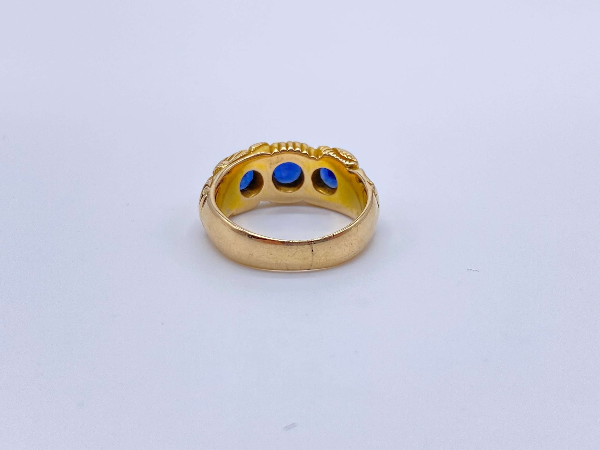 Hand Chased Victorian Ring with SapphiresA lovely c. 1890s Victorian ring hand chased with what appears to be a snake motif. 3 large sapphires are set into the ring. This ring has an amazing weight to it. Condition: Normal antique wear, very minimal scrat