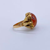 Antique Victorian Carnelian Peacock RingA gorgeous late Victorian ring with a substantial central carnelian stone. This ring has beautiful ruffled gold work around the stone. Two peacocks are suspended right above the shank. Condition: Normal antique wear