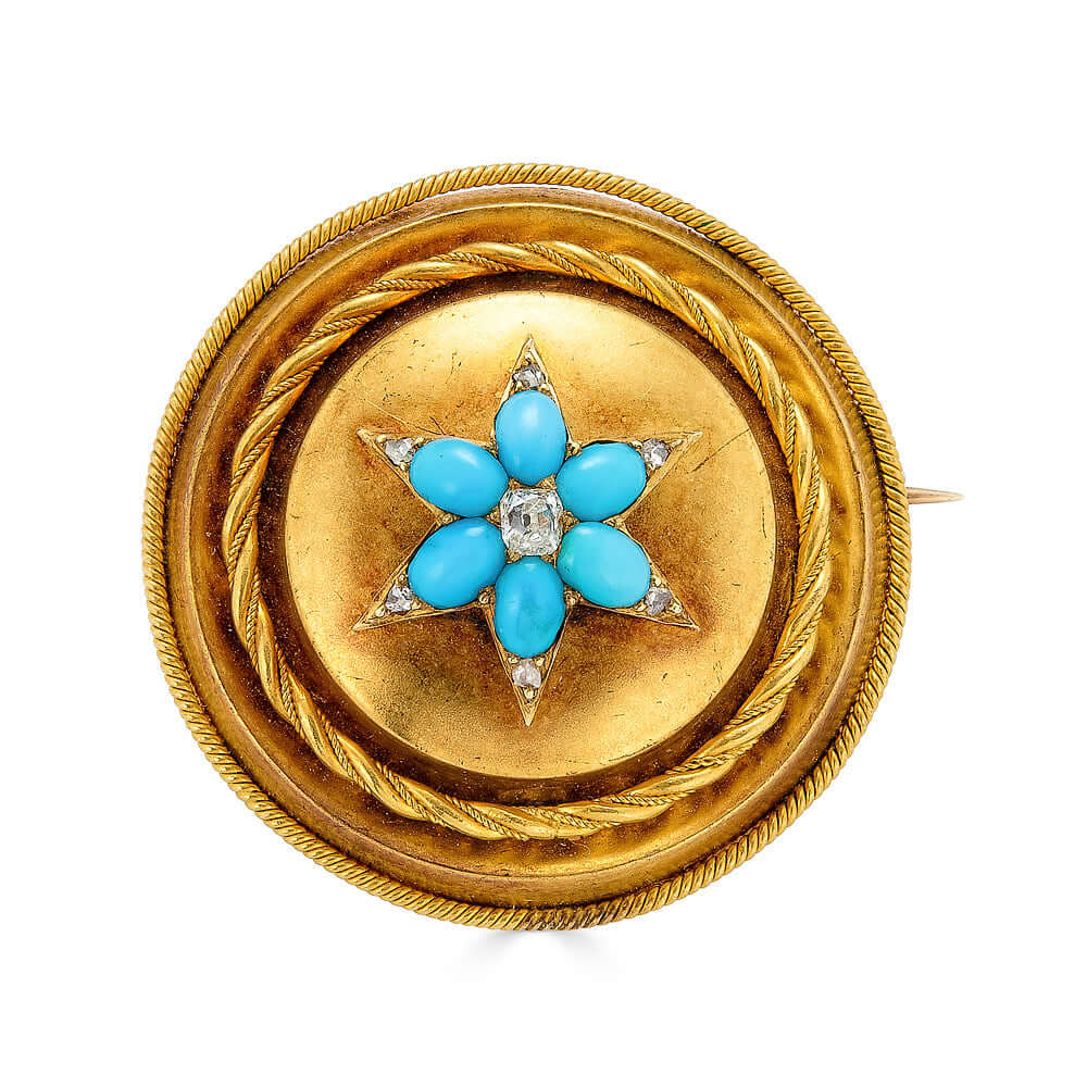 Victorian Etruscan Revival Turquoise and Diamond BroochA gorgeous mid victorian brooch in vibrant bloomed gold with 6 central Persian turquoise, a center diamond, and 6 tiny diamonds at each point. On the reverse, there is a compartment with glass and fab