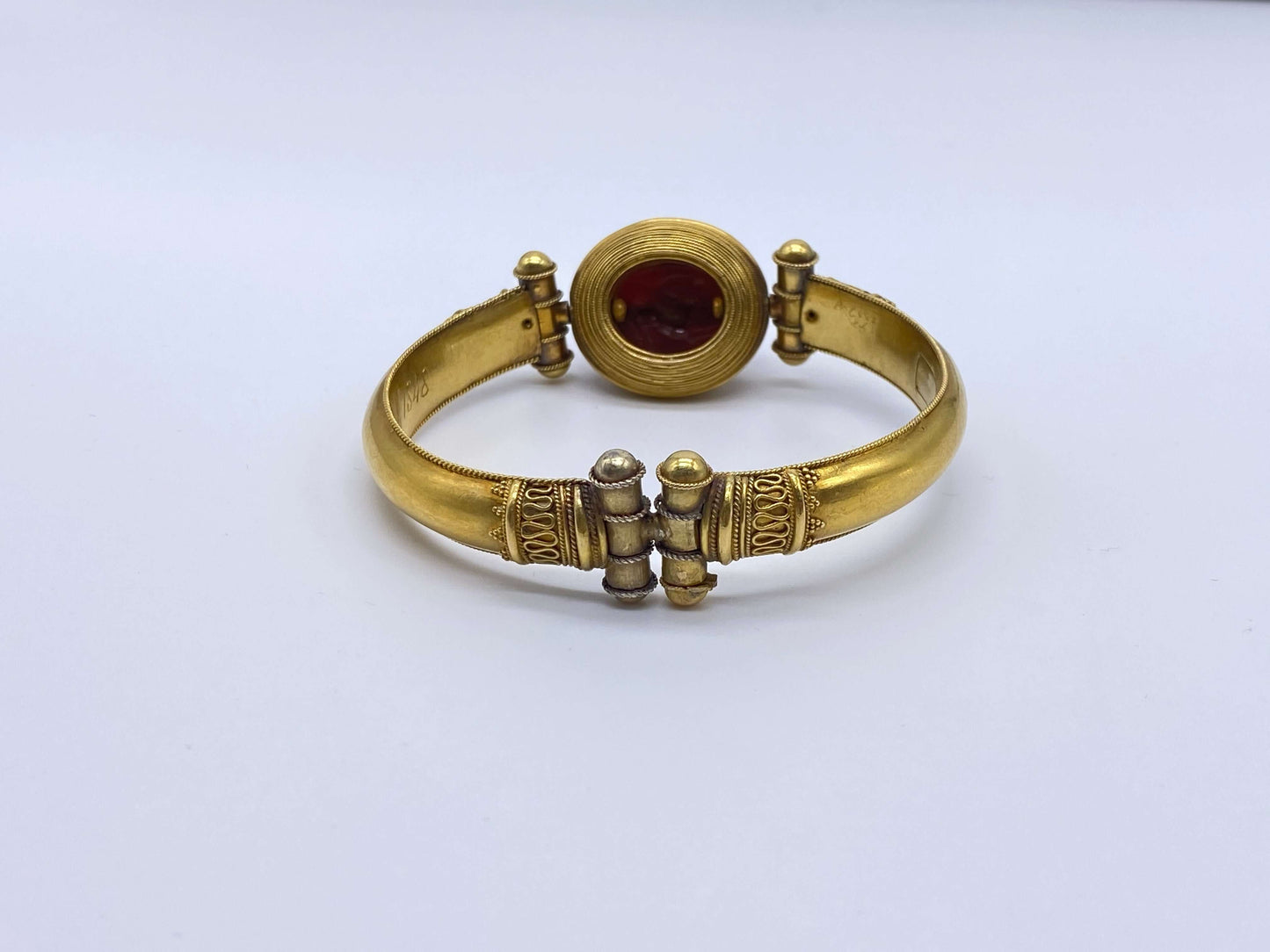 Egyptian Revival Bracelet with ScarabThis bracelet is gorgeous and special. Victorian Architectural revival jewelry is lovely and inspired by ancient cultures. This bracelet is comprised of gold and a hard stone scarab. The scarab is likely not ancient an