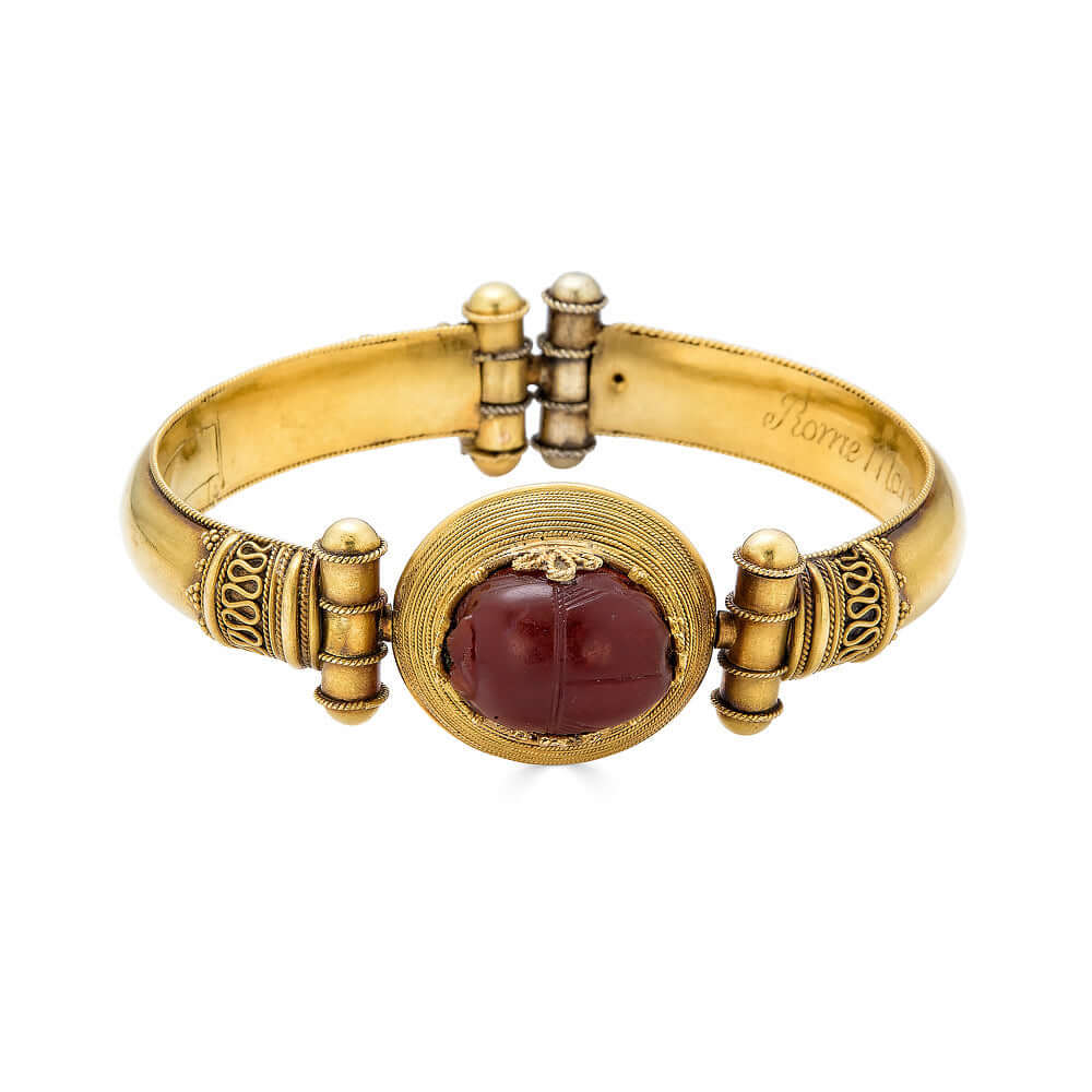 Egyptian Revival Bracelet with ScarabThis bracelet is gorgeous and special. Victorian Architectural revival jewelry is lovely and inspired by ancient cultures. This bracelet is comprised of gold and a hard stone scarab. The scarab is likely not ancient an