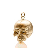 Necklaces 14k Gold & Opal Nehama Pendant A satin finished pendant inspired by a skull found in the Paris Catacombs. This hollow 14k gold skull features a gorgeous hand carved natural opal drop. This statement making pendant is named after Sarah Nehama, a