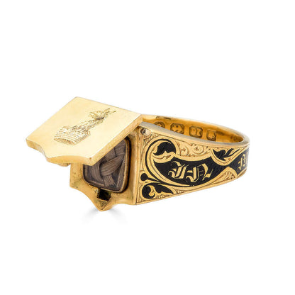 Black Enamel Mourning Ring with Hair CompartmentA special and lovely example of Victorian Mourning Jewelry. A gold mourning ring with a compartment that opens up to reveal woven hair behind glass. On the lid appears to be a crest with a gryphon and crown.