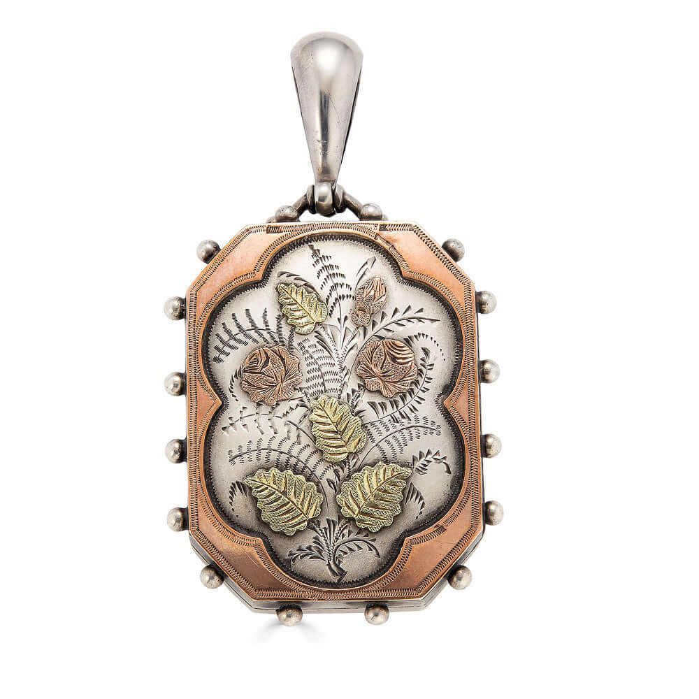 Floral Silver & Gilt LocketA beautiful large Victorian locket crafted in silver with lovely rose and green gold gilt work. The Locket opens easily and can be used to store a photo or a small memento. Please note that this pendant doesn’t include a chain.