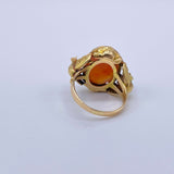 Antique Victorian Carnelian Peacock RingA gorgeous late Victorian ring with a substantial central carnelian stone. This ring has beautiful ruffled gold work around the stone. Two peacocks are suspended right above the shank. Condition: Normal antique wear