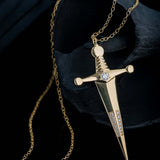18k Gold Kelly Sword PendantA Luxe sword 18k Gold Kelly Sword Pendant for the individual wanting to make a powerful statement. Our Jewelry is proudly idealized, and produced in NYC.18k Gold Kelly Sword PendantA Luxe sword pendant for the individual wantin