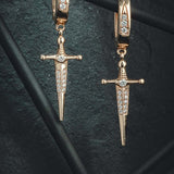 18k Gold Kelly Sword EarringsA Pair of solid gold 18k Gold Kelly Sword Earrings that make a statement. Swords are iconic symbols of strength and these unisex earrings embody this. 18k Gold Kelly Sword EarringsA Pair of solid gold earrings that make a stat